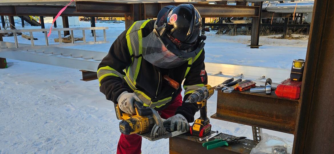 Epscan employee working in winter in proper PPE.